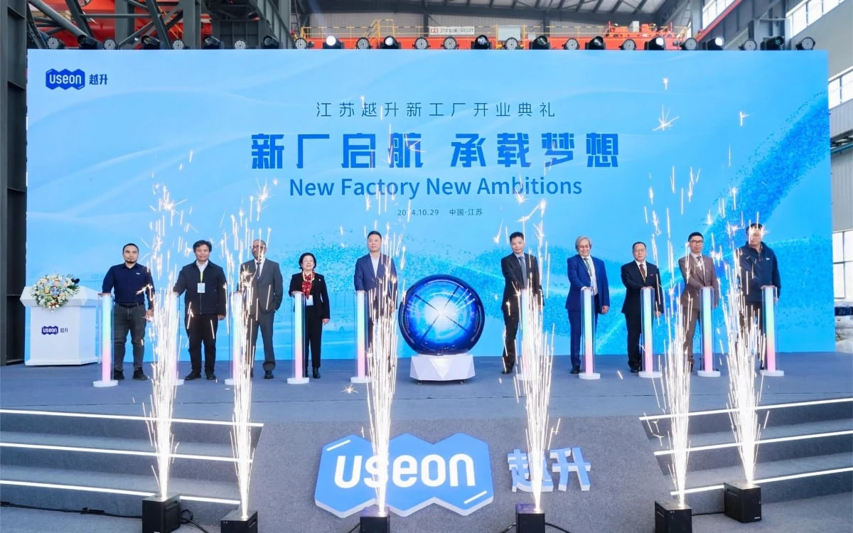 Guests on stage launching the new factory