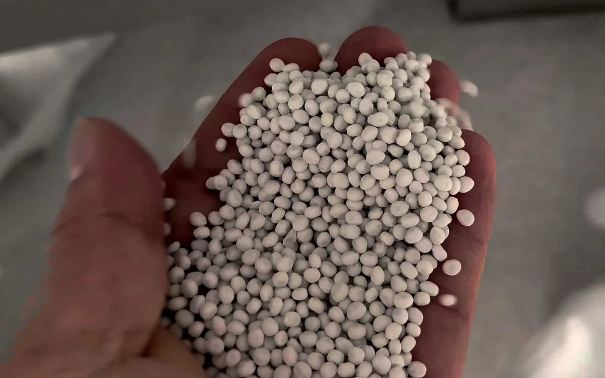 Rounded PP and calcium carbonate pellets held in a hand from the SAT110 project