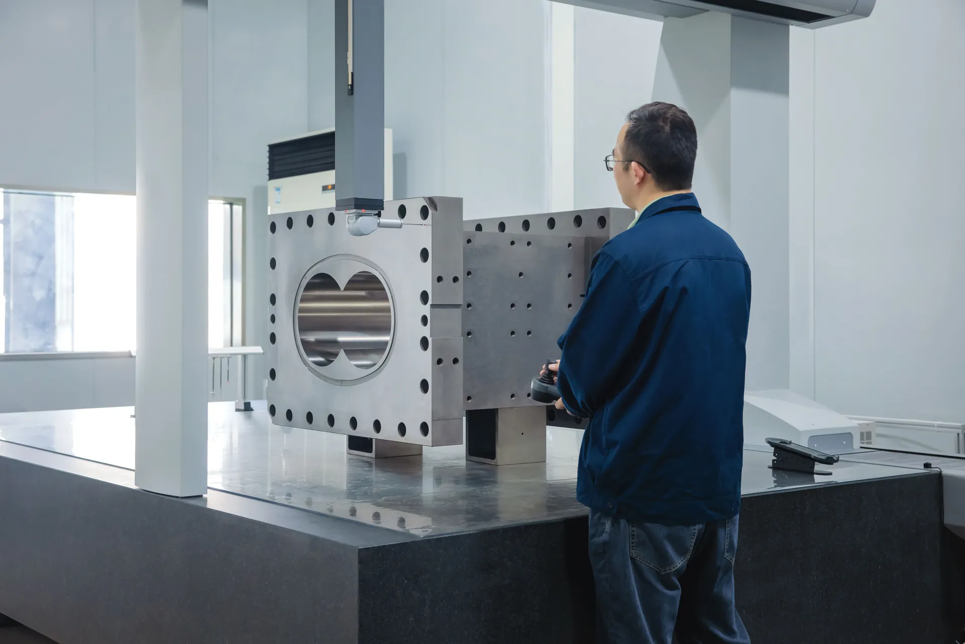Bridge coordinate measuring machine checking a barrel bore