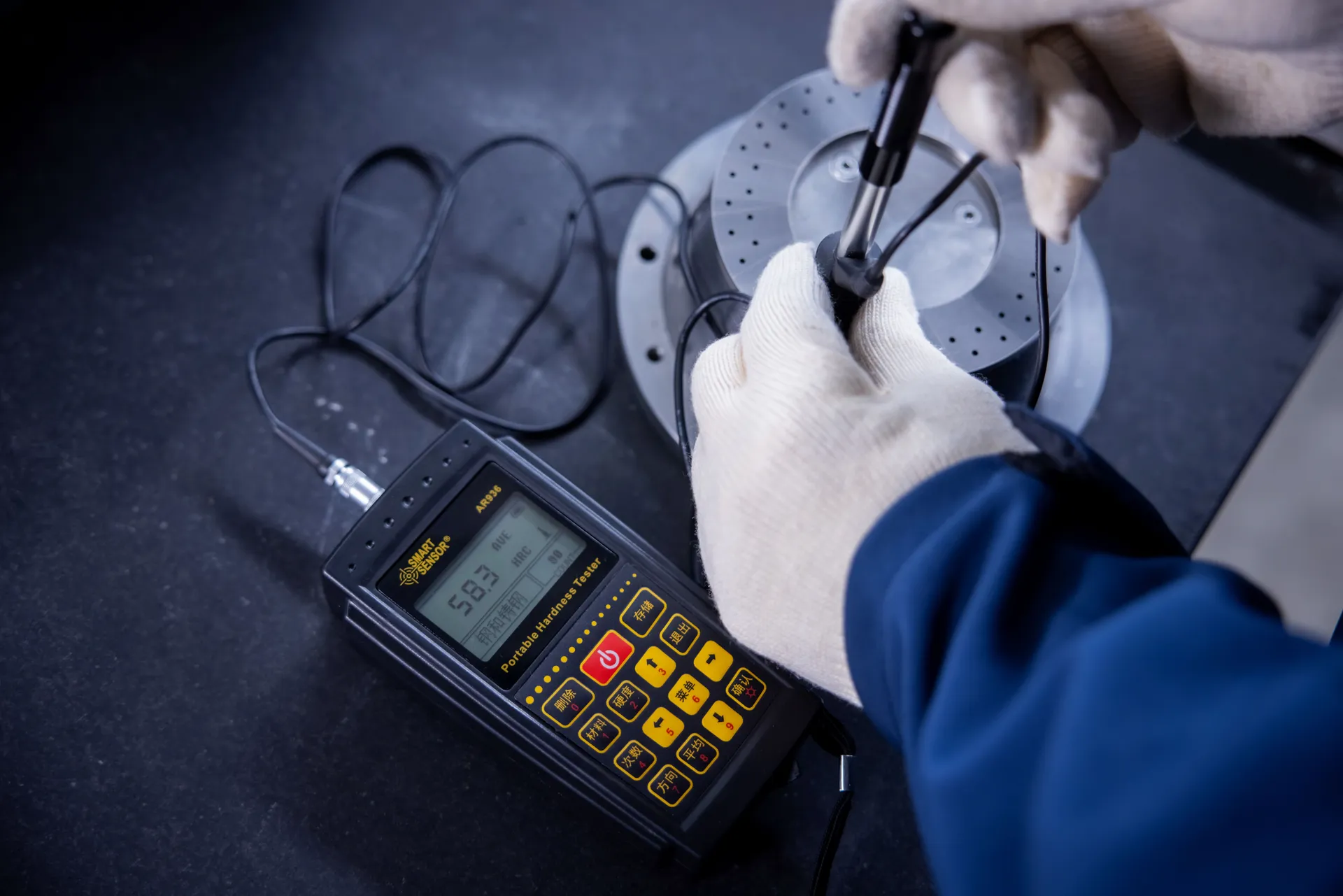 Portable hardness tester on a machined part